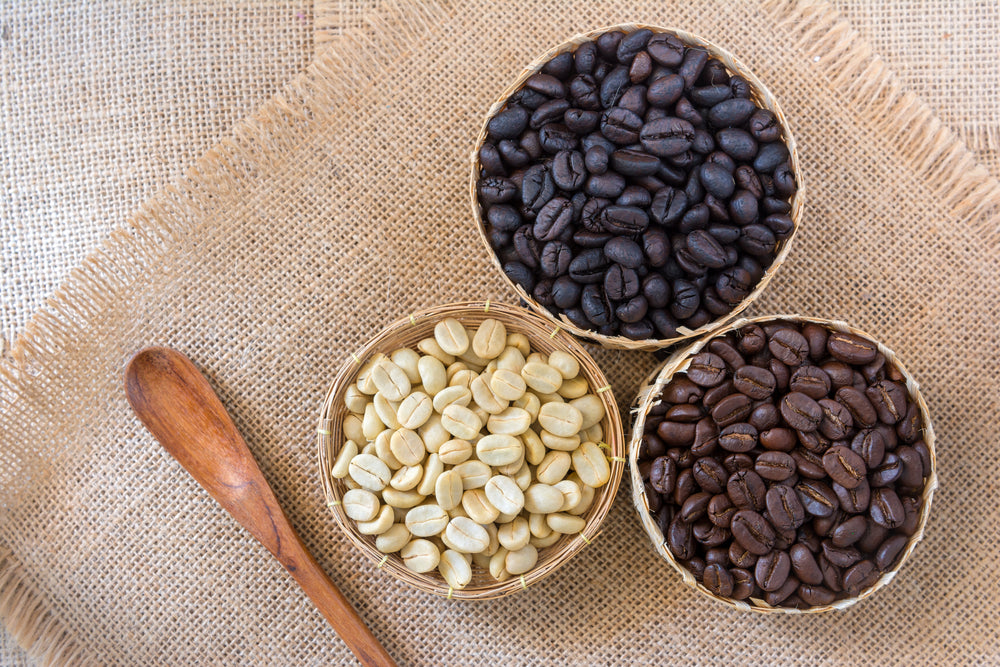 Coffee beans that have not been roasted and roast coffee beans and light roast coffee beans to put in the basket.