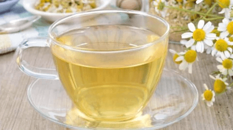 weaverscoffee.mom Glass tea cup and saucer of Chamomile Herbal Tea.