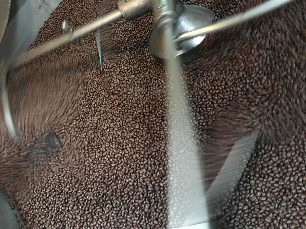 weaverscoffee.mom Peaberry Reserve Coffee in the coffee roaster cooling tray.